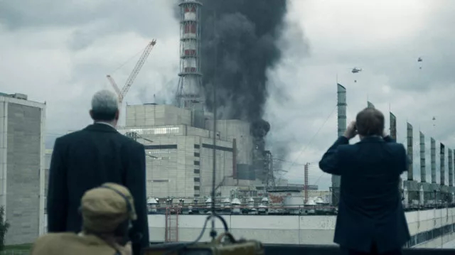 A frame from the miniseries Chernobyl showing helicopters dropping sand and boron onto the reactor core | Credit: HBO