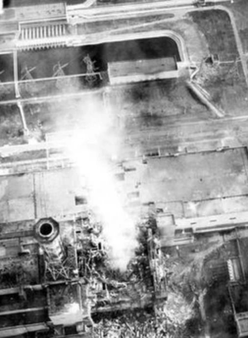 This aerial view of the reactor core was photographed from a helicopter on May 3, 1986. It shows the destroyed Reactor No. 4. The smoke came from burning graphite and the melting core. | Credit: wikizero